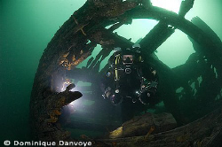 Rebreather diver coming out of the Robert Gaskin wreck, S... by Dominique Danvoye 